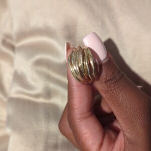 A gold colored bronze ring